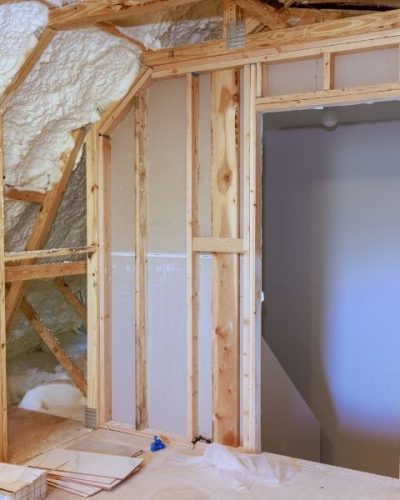 Spray foam insulation is used to insulate wall of an under construction site